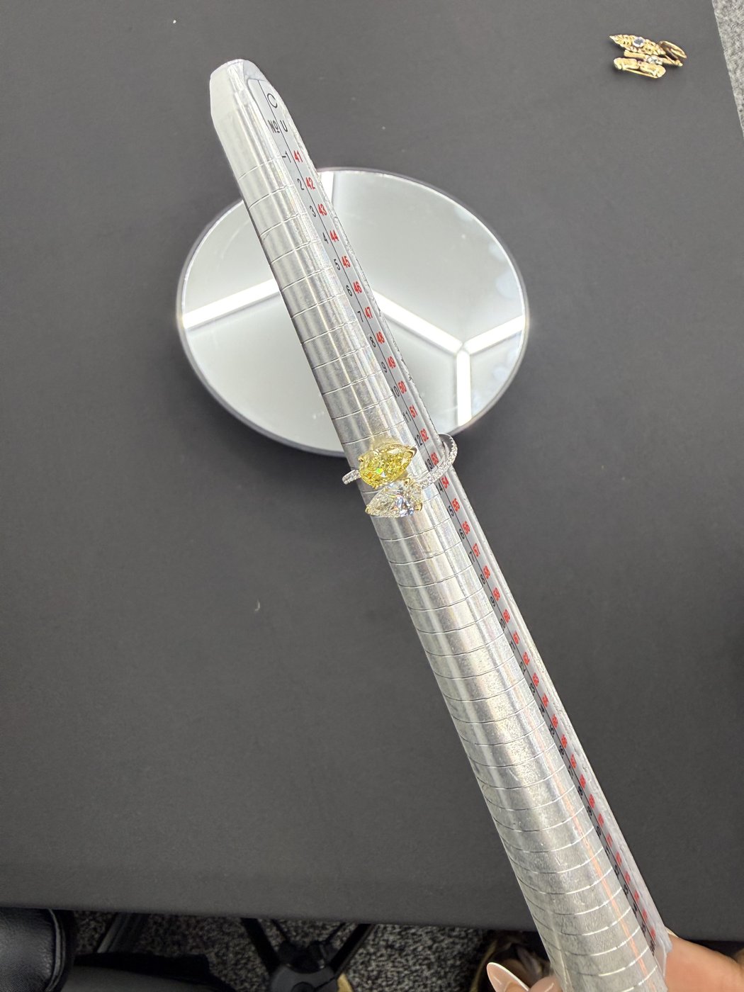 Rings positioned on a sizing mandrel